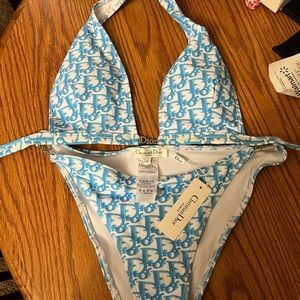 Christian diors swim suit size xlg fits like a medium/large